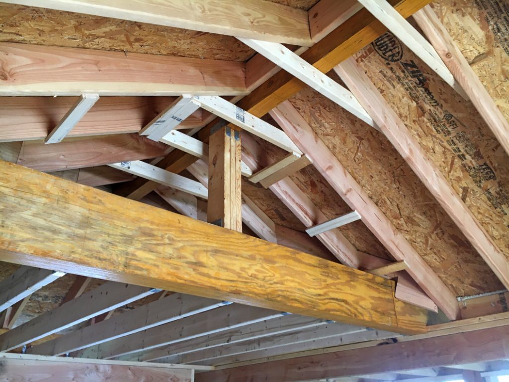 Detail of the LVL structural support and rafter tie-in where the sunroom roof meets the garage roof
