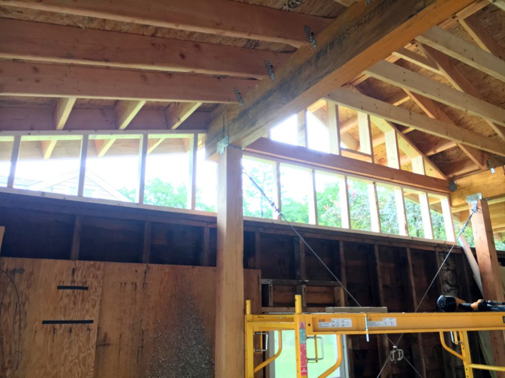 Back-framing the old garage wall to meet the new roof