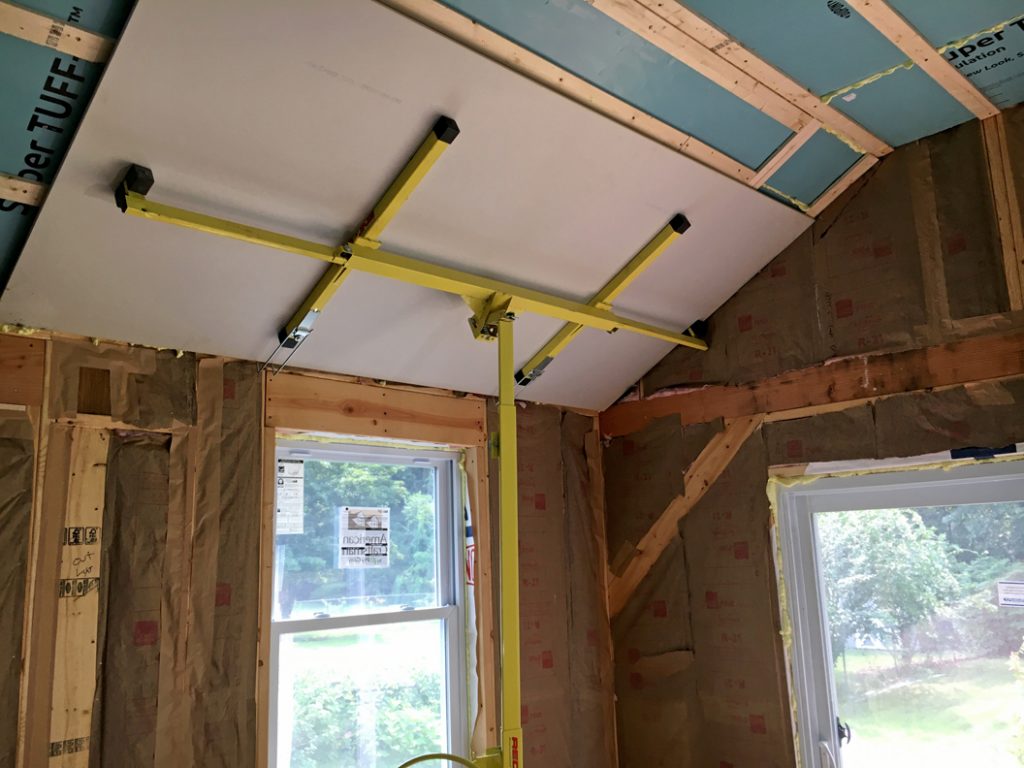 1/2 inch drywall going in using a drywall hoist