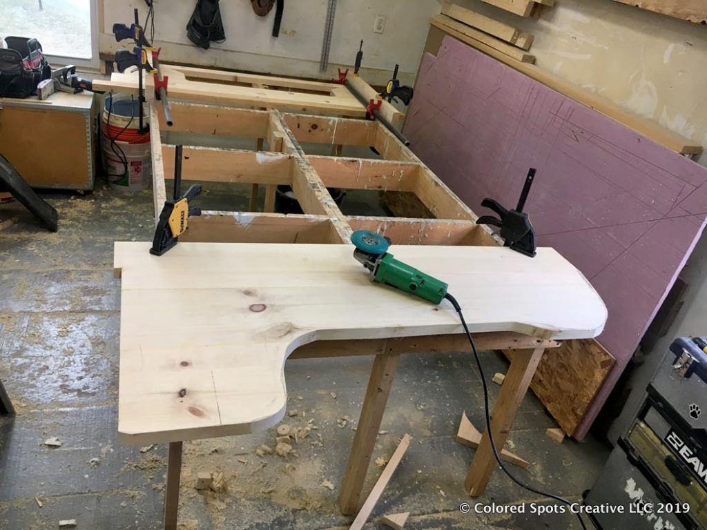 Carving keyboard tray with a grinder