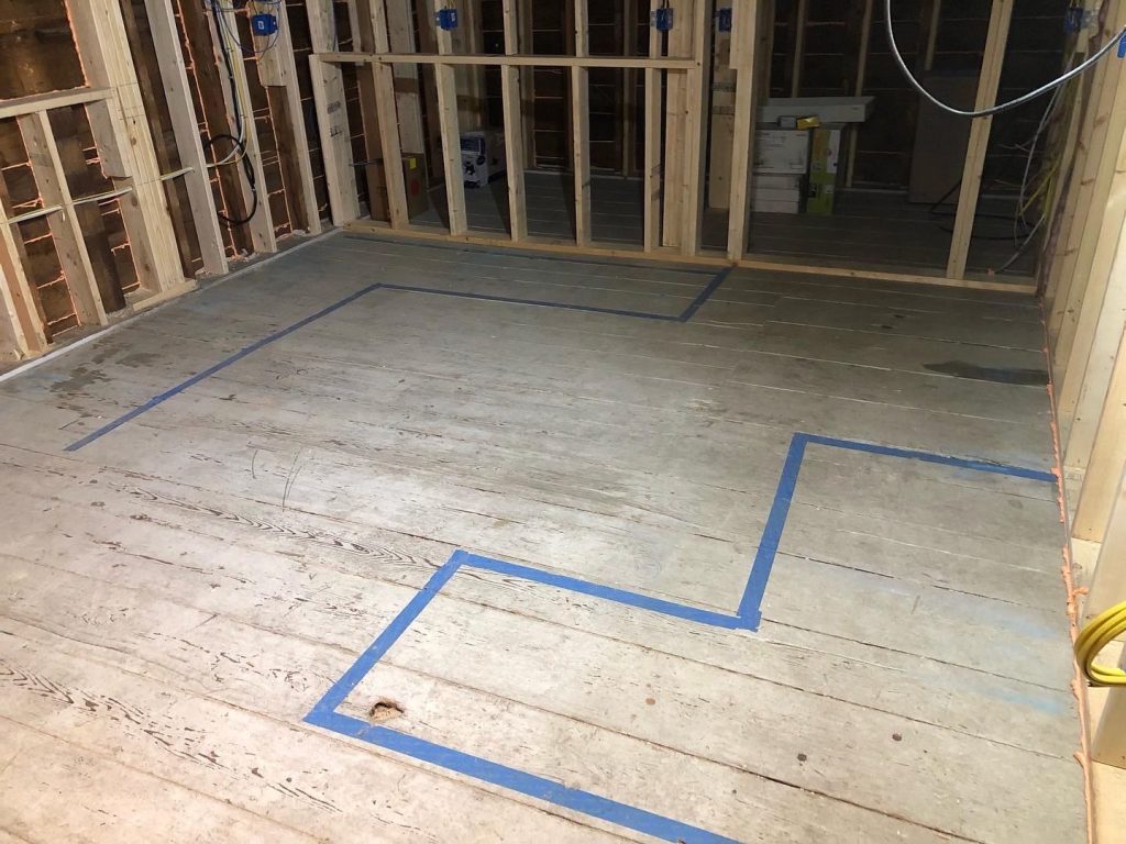Kitchen tape layout on the existing barn floor