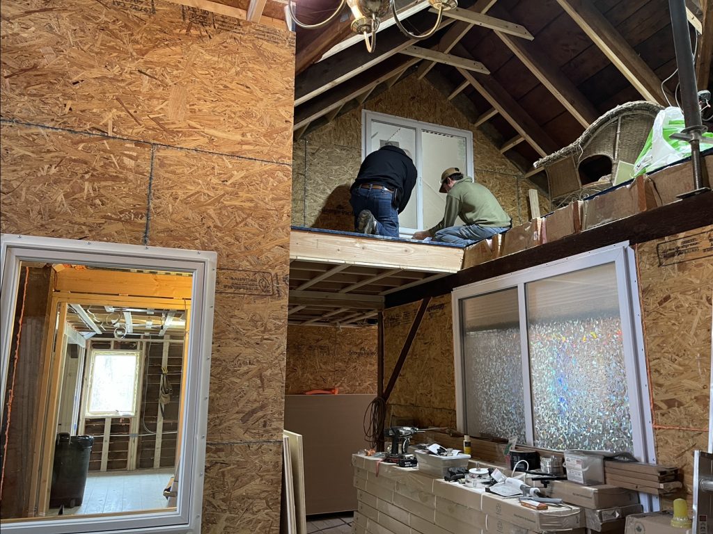 Sheathing the interior wall to the Common Area