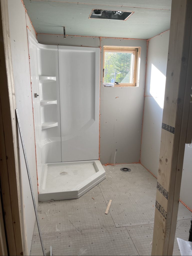 Shower surround goes in the bathroom