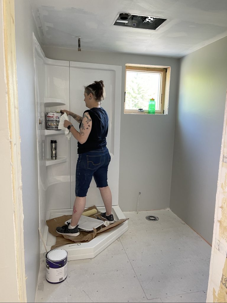 Shower surround being caulked